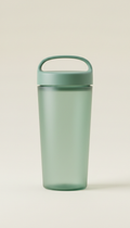 A Fresh Green eco-friendly water cup is perfectly centered against a light-colored, the image is straight-on with soft,...